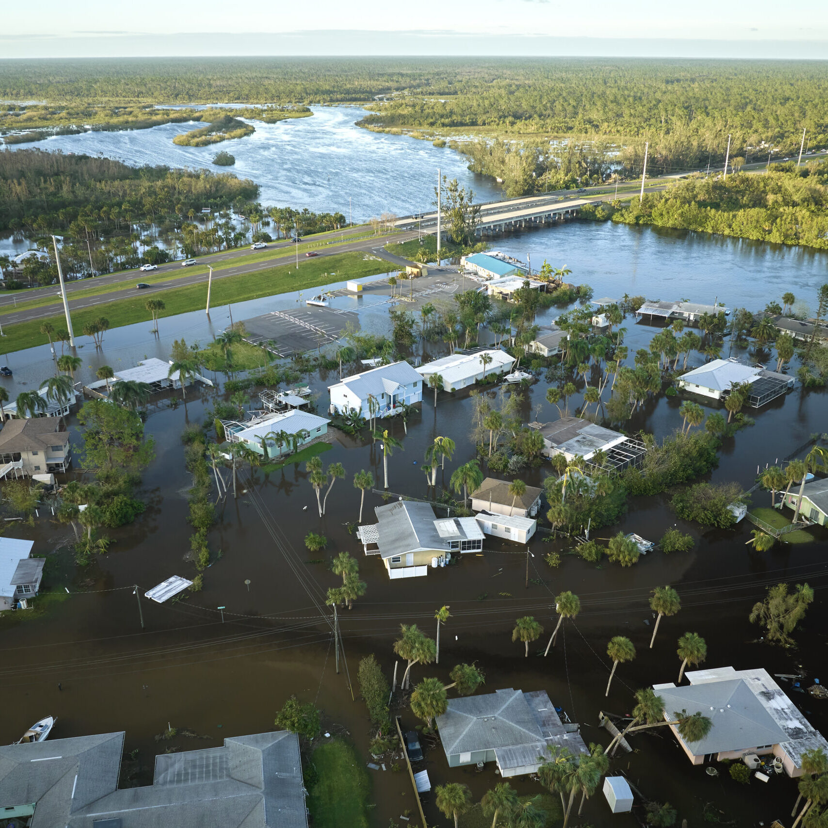 Hurricane Ian flooded houses in Florida residential area. Natural disaster and its consequences Flooded houses from hurricane